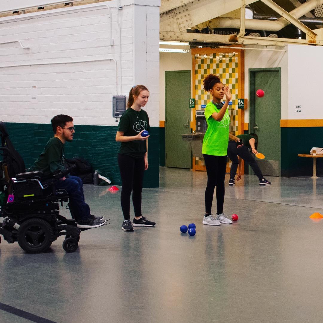 Participants playing with hacky sacks